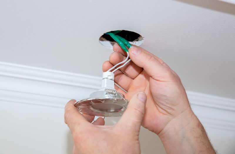 Handyman Installing Light Fixture